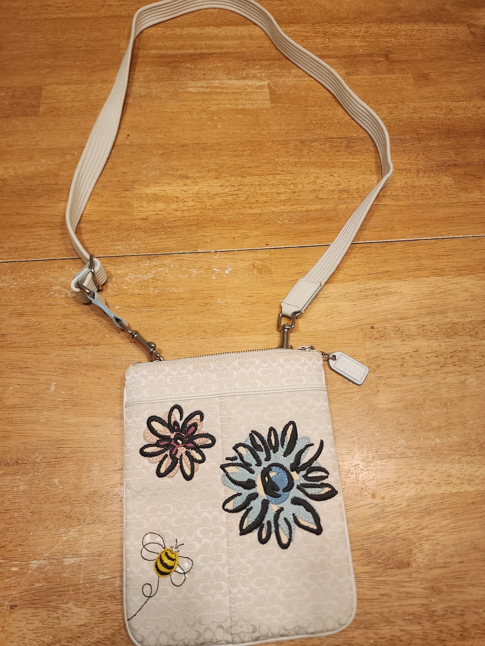 vintage Coach Signature Swingpack featuring embroidered flower and bumble bee